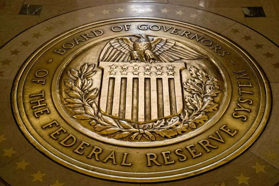 FILE - This Feb. 5, 2018, file photo shows the seal of the Board of Governors of the United States Federal Reserve System in the ground at the Marriner S. Eccles Federal Reserve Board Building in Washington.  The Senate on Thursday, Dec. 3, 2020,  narrowly confirmed the nomination of Christopher Waller for the Federal Reserve’s Board of Governors, placing another of President Donald Trump’s picks on the Fed’s influential board after a string of high-profile rejections. The vote in favor of Waller’s appointment was 48-47. (AP Photo/Andrew Harnik, File)