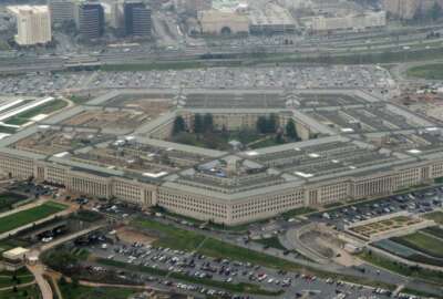 FILE - This March 27, 2008 file photo shows the Pentagon in Washington. The civilian official overseeing the Pentagon's campaign to defeat the Islamic State group in the Middle East has resigned in the latest jolt to Pentagon leadership in the waning weeks of the Trump administration.(AP Photo/Charles Dharapak, File)