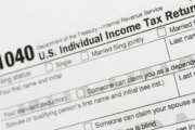 FILE - This July 24, 2018, file photo shows a portion of the 1040 U.S. Individual Income Tax Return form. It’s the time of year to start thinking about taxes - what's ahead and what can be done now to manage. But the upcoming tax filing season is going to be trickier for many Americans due to rampant unemployment, working from home and general upheaval due to COVID-19. (AP Photo/Mark Lennihan, File)