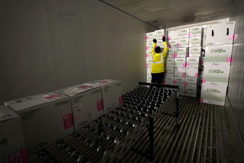 FILE - In this Dec. 20, 2020, file photo, boxes containing the Moderna COVID-19 vaccine are loaded into a truck for shipping at the McKesson distribution center in Olive Branch, Miss. While shipments of the vaccine are rolling out to many health care workers and nursing homes across the country, it could be months before it’s available for the general public. (AP Photo/Paul Sancya, Pool, File)