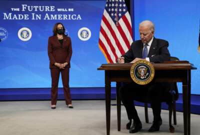 President Joe Biden signs an executive order on American manufacturing, in the South Court Auditorium on the White House complex, Monday, Jan. 25, 2021, in Washington. (AP Photo/Evan Vucci)