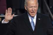 Joe Biden holds up his right hand as he is sworn in as the 46th president of the United States during the 59th Presidential Inauguration at the U.S. Capitol in Washington, Wednesday, Jan. 20, 2021. (Saul Loeb/Pool Photo via AP)