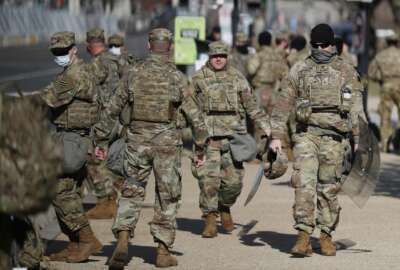 National Guard troops continue to be deployed around the Capitol one day after the inauguration of President Joe Biden, Thursday, Jan. 21, 2021, in Washington. (AP Photo/Rebecca Blackwell)