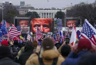 FILE - In this Jan. 6, 2021 file photo, Trump supporters participate in a rally in Washington.  An AP review of records finds that members of President Donald Trump’s failed campaign were key players in the Washington rally that spawned a deadly assault on the U.S. Capitol last week. (AP Photo/John Minchillo)