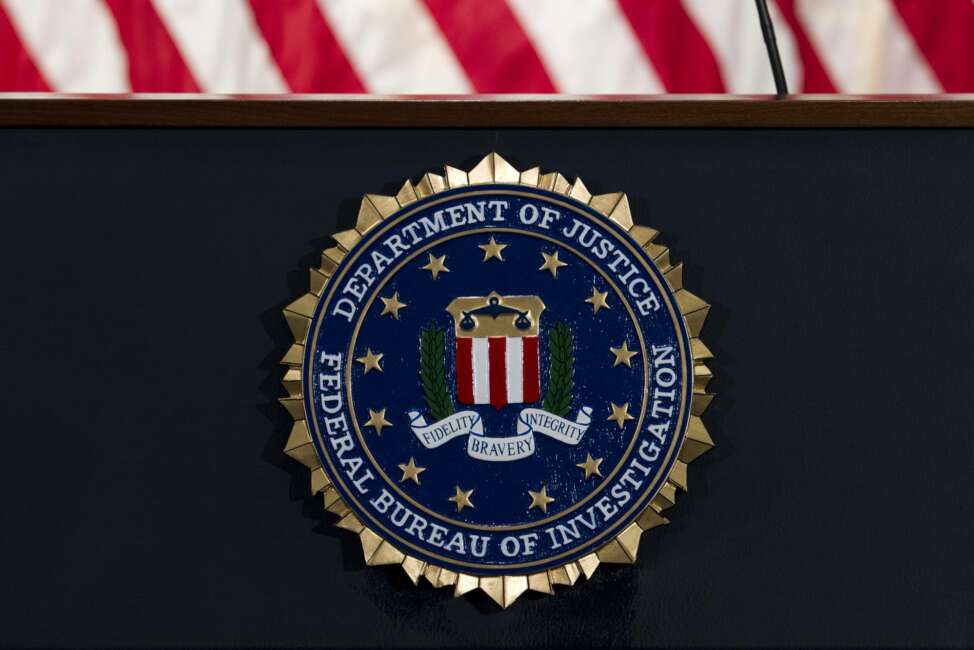 FILE - In this June 14, 2018, file photo, the FBI seal is seen before a news conference at FBI headquarters in Washington. The U.S. government on Tuesday, Jan. 5, 2021, said a devastating hack of federal agencies is “likely Russian in origin” and said the operation appeared to be an “intelligence gathering” effort. The assessment was disclosed in a rare public statement from the FBI and other investigative agencies. (AP Photo/Jose Luis Magana, File)