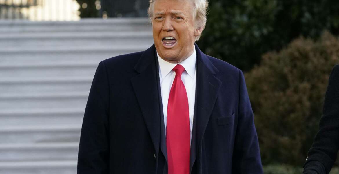 President Donald Trump speaks with reporters as he walks to board Marine One on the South Lawn of the White House, Wednesday, Jan. 20, 2021, in Washington. Trump is en route to his Mar-a-Lago Florida Resort. (AP Photo/Alex Brandon)