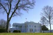 An American flag flies above the White House in Washington, Sunday, Jan. 10, 2021. (AP Photo/Patrick Semansky)