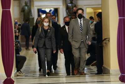 Impeachment managers Rep. Madeleine Dean, D-Pa., and Rep. Jamie Raskin, D-Md., walk to the House chamber on Capitol Hill in Washington, Wednesday, Jan. 13, 2021. (AP Photo/Susan Walsh)