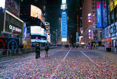 Confetti lies on the street after the Times Square New Year's Eve ball dropped in a nearly empty Times Square early Friday, Jan. 1, 2021, as the area normally packed with revelers was closed because of the ongoing coronavirus pandemic. (AP Photo/Craig Ruttle)