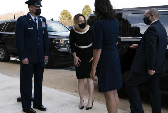Deputy Secretary of Defense Kathleen Hicks, center, arrives at the Pentagon, Tuesday, Feb. 9, 2021, in Washington. (AP Photo/Jose Luis Magana)
