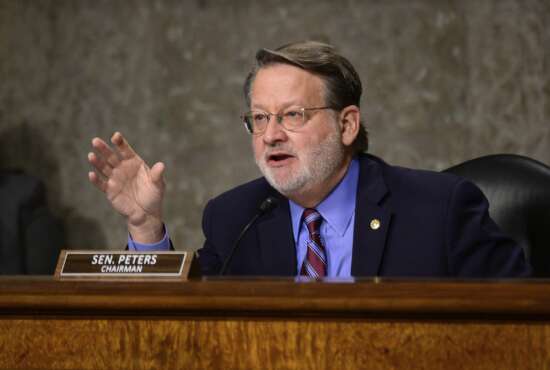 Chairman Sen. Gary Peters., D-Mich., speaks during a Senate Homeland Security and Governmental Affairs & Senate Rules and Administration joint hearing on Capitol Hill, Washington, Tuesday, Feb. 23, 2021, to examine the January 6th attack on the Capitol. (Erin Scott/The New York Times via AP, Pool)