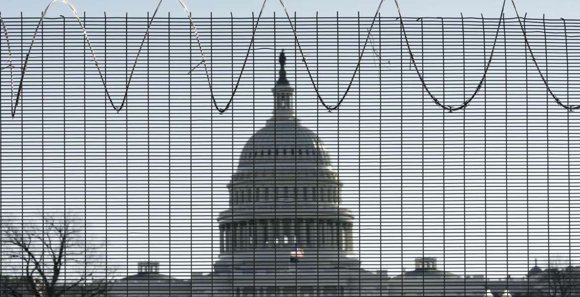 Fencing and razor wire surrounds the perimeter of the Capitol in Washington, Thursday, Feb. 25, 2021. (AP Photo/J. Scott Applewhite)