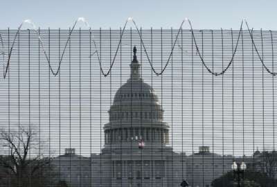 Fencing and razor wire surrounds the perimeter of the Capitol in Washington, Thursday, Feb. 25, 2021. (AP Photo/J. Scott Applewhite)