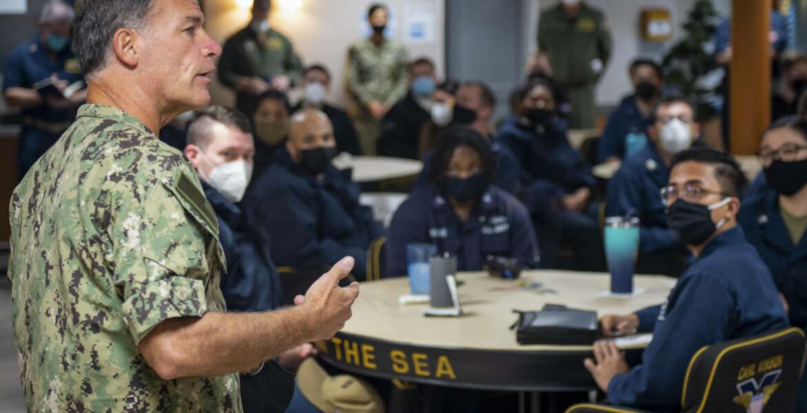 In this Feb. 8, 2021, photo provided by the U.S. Navy, Adm. John Aquilino, commander, U.S. Pacific Fleet, speaks with sailors assigned to the USS Carl Vinson (CVN 70). Senior U.S. Navy commanders met with sailors on ships on the West Coast Monday and Tuesday, after two recent racist incidents triggered one of the first military stand-downs to address extremism in the ranks. (Mass Communication Spc. Seaman Apprentice Mason Congleton/U.S. Navy via AP)