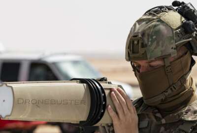 In this Jan. 27, 2021, handout image released by the U.S. Air Force, a soldier with the U.S. Air Force's 378th Air Expeditionary Wing trains members of the Royal Saudi Air Force Police Wing how to use equipment to counter drone attacks at at Prince Sultan Air Base near Riyadh, Saudi Arabia. Yemen's Houthi rebels on Wednesday, Feb. 10, 2021, targeted Abha International Airport in southwestern Saudi Arabia, causing a civilian plane on the tarmac to catch fire, the kingdom's state television reported, an attack that threatens to escalate Yemen's grinding war. Authorities initially suspected the attack was carried out by a drone. (U.S. Air Force/Senior Airman Leala Marquez, via AP)