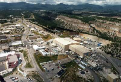 FILE - This undated file aerial view shows the Los Alamos National Laboratory in Los Alamos, N.M. A top nuclear security official says the U.S. must move ahead with plans to ramp up production of key components for the nation's nuclear arsenal despite the challenges presented by the coronavirus. Federal officials have set a 2030 deadline for increased production of the plutonium cores used in nuclear weapons. The work will be split between this facility in New Mexico and South Carolina and will attract billions of federal dollars. (Albuquerque Journal via AP, File)