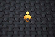 Unique color yellow human shape among dark ones. Leadership, individuality and standing out of crowd concept. 3D illustration