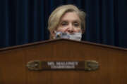 Committee chairwoman Rep. Carolyn Maloney, D-New York, speaks during a House Oversight and Reform Committee hearing on "Legislative Proposals to Put the Postal Service on Sustainable Financial Footing" on Capitol Hill, Wednesday, Feb. 24, 2021, in Washington. United States Postal Service Postmaster General Louis DeJoy is left.  (Jim Watson/Pool via AP)