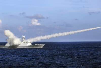 FILE - In this July 8, 2016, file photo released by Xinhua News Agency, Chinese missile frigate Yuncheng launches an anti-ship missile during a military exercise in the waters near south China's Hainan Island and Paracel Islands. Ahead of the 2021 annual Congress meetings, China is continuing its military buildup and recently passed a law authorizing its coast guard to use force to remove foreign presences in what it considers Chinese waters and islands. (Zha Chunming/Xinhua via AP, File)