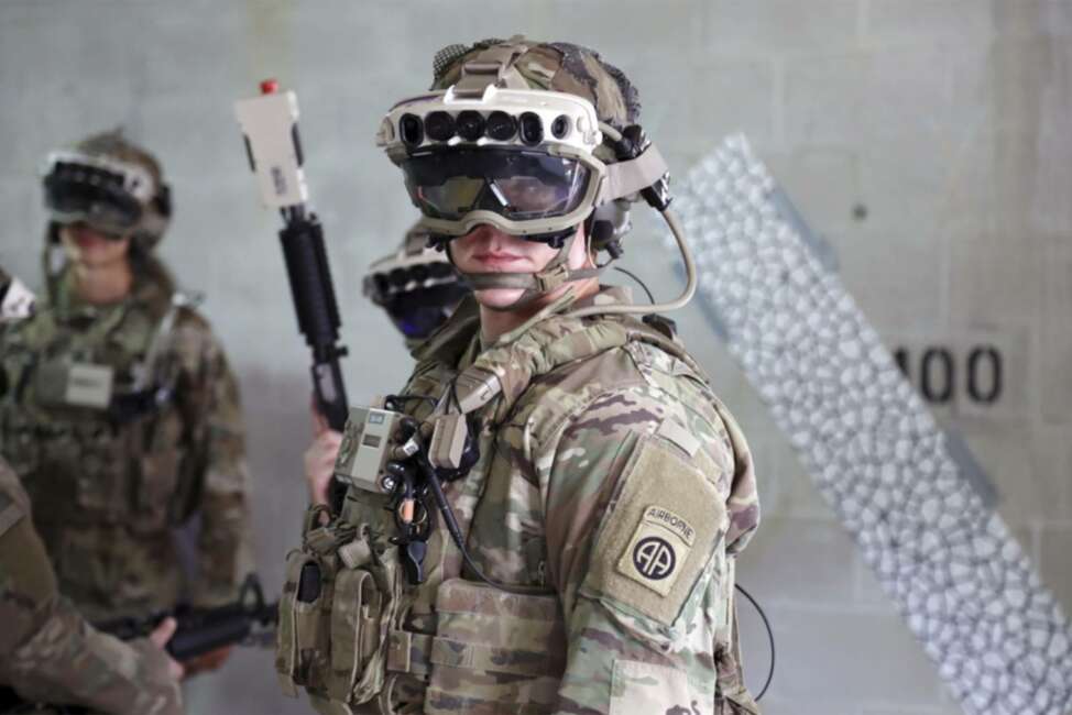 In this Oct. 21, 2020, photo provided by the U.S. Army, soldiers don a military prototype of the Army’s Integrated Visual Augmentation System (IVAS) and wield a Squad immersive Virtual Trainer (SiVT) during a training environment and test event at Fort Pickett, Va. Microsoft won a nearly $22 billion contract to supply U.S. Army combat troops with its virtual reality headsets. Microsoft and the Army separately announced the deal Wednesday, March 31, 2021. (Courtney Bacon/U.S. Army via AP)