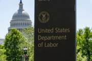 FILE - In this May 7, 2020, file photo, the entrance to the Labor Department is seen near the Capitol in Washington. Unemployment fraud in the U.S. has reached dramatic levels during the pandemic: more than $63 billion has been paid out improperly through fraud or errors since March 2020. Criminals are seizing on the opportunity created by the pandemic and are making false claims using stolen information. (AP Photo/J. Scott Applewhite, File)