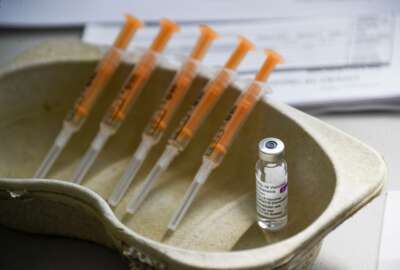 FILE - In this Sunday, March 21, 2021 file photo a vial and syringes of the AstraZeneca COVID-19 vaccine, at the Guru Nanak Gurdwara Sikh temple, on the day the first Vaisakhi Vaccine Clinic is launched, in Luton, England. AstraZeneca said Monday March 22, 2021 that advanced trial data from a U.S. study on its COVID vaccine shows it is 79% effective. The U.S. study comprised 30,000 volunteers, 20,000 of whom were given the vaccine while the rest got dummy shots. (AP Photo/Alberto Pezzali, File)