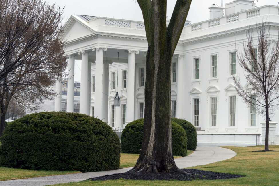 In this March 18, 2021 photo, the White House is shown in Washington. Five White House staffers have been fired because of their past use of drugs, including marijuana. White House press secretary Jen Psaki said Friday "there were additional factors at play in many instances for the small number of individuals who were terminated." (AP Photo/Andrew Harnik)