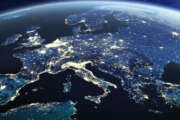 Europe viewed from space at night with city lights in European Union member states, global EU business and finance, satellite communication technology, 3D render of planet Earth, world map from NASA (https://eoimages.gsfc.nasa.gov/images/imagerecords/57000/57752/land_shallow_topo_2048.jpg)