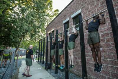 Force Fitness Instructor (FFI) Trainers demonstrate proper pull-up technique for the class of FFI students before executing practical application as part of their course requirement at Marine Corps Base Quantico, Virginia, October 3, 2016. The FFI course is made up of physical training, classroom instruction and practical application to provide the students with a holistic approach to fitness. Upon completion, the Marines will return to serve as unit FFIs, capable of designing individual and unit-level holistic fitness programs.