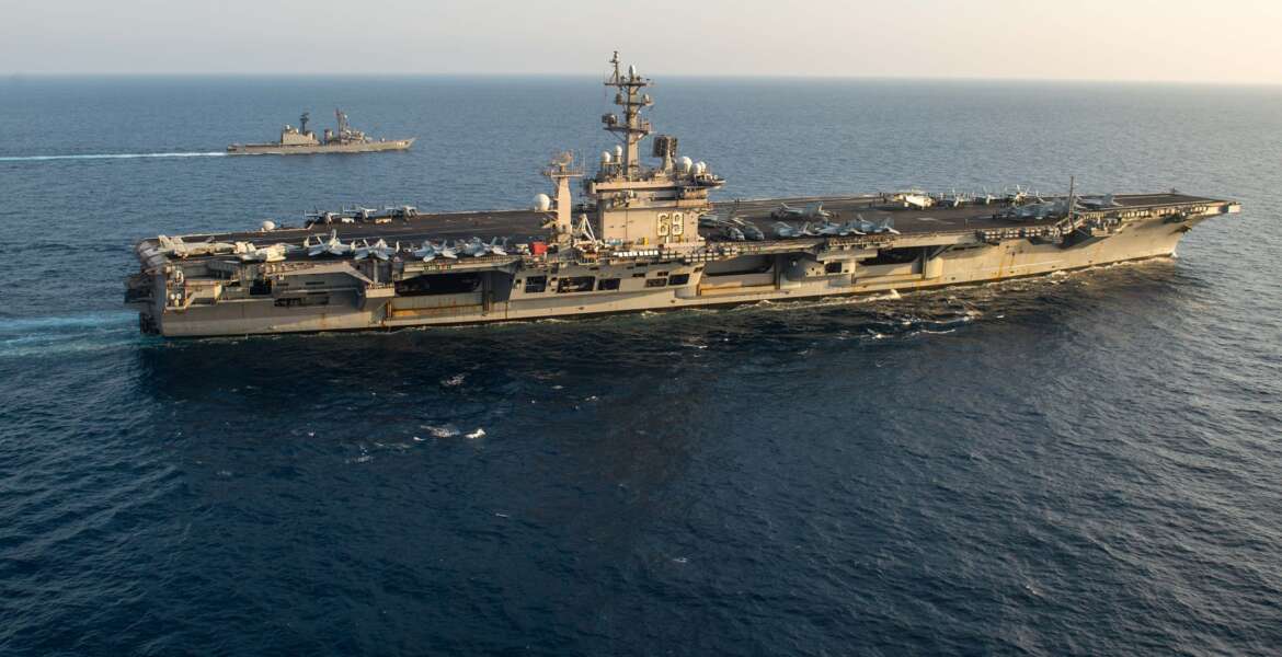 The aircraft carrier USS Dwight D. Eisenhower (CVN 69) conducts flight operations and sails with the Japanese Maritime Self Defense Force destroyer Setogiri (DD 156), in the Arabian Sea. The Eisenhower Carrier Strike Group is deployed to the U.S. Naval Forces Central Command / U.S. 5th Fleet area of operations in support of naval operations to ensure maritime stability and security in the region. (Photo by MC3 Sawyer Haskins)