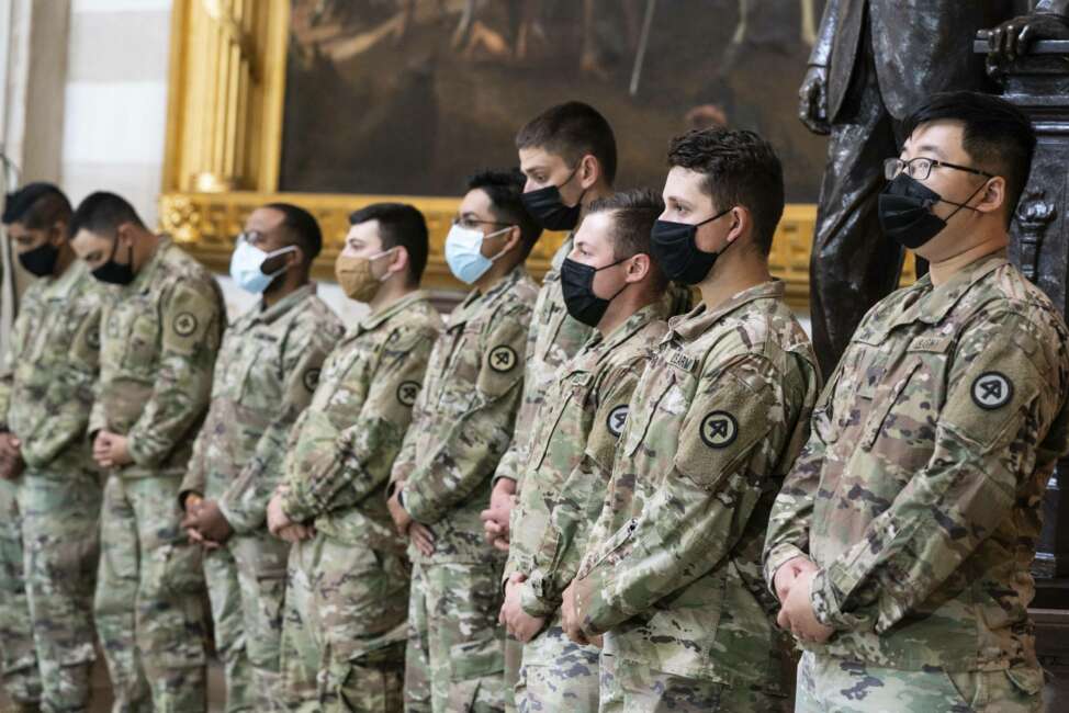 National Guard troops pay respects to U.S. Capitol Police officer William "Billy" Evans, as Evans lies in honor in the Rotunda at the U.S. Capitol, Tuesday, April 13, 2021 in Washington.(Anna Moneymaker/The New York Times via AP, Pool)