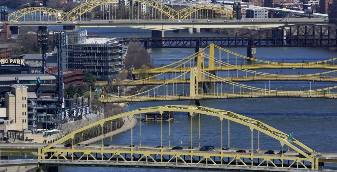 FILE - This April 2, 2021, file photo shows bridges spanning the Allegheny River in downtown Pittsburgh. Republicans in Congress are making the politically brazen bet that it’s more advantageous to oppose President Joe Biden’s ambitious rebuild America agenda than to lend support for the costly $2.3 trillion undertaking for roads, bridges and other infrastructure investments. (AP Photo/Gene J. Puskar, File)