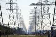 FILE - This Tuesday, Feb. 16, 2021 file photo shows power lines in Houston. The Biden administration is taking steps to protect the country’s electric system from cyberattacks through a new 100-day initiative combining federal government agencies and private industry. The initiative was announced Tuesday by the Energy Department. (AP Photo/David J. Phillip)