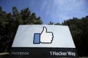 FILE - In this April 14, 2020, file photo, the thumbs up Like logo is shown on a sign at Facebook headquarters in Menlo Park, Calif. Facebook said Tuesday, April 6, 2021, it has removed hundreds of fake accounts linked to an Iranian exile group and a troll farm in Albania. (AP Photo/Jeff Chiu, File)