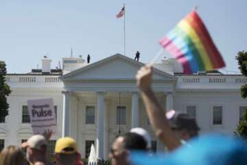 FILE - In this Sunday, June 11, 2017 file photo, Equality March for Unity and Pride participants march past the White House in Washington. The Biden administration says the government will protect gay and transgender people against sex discrimination in health care. That reverses a Trump-era policy that sought to narrow the scope of legal rights in sensitive situations involving medical care. Health and Human Services Secretary Xavier Becerra said Monday that LGBTQ people should have the same access to health care as everyone else. T(AP Photo/Carolyn Kaster)