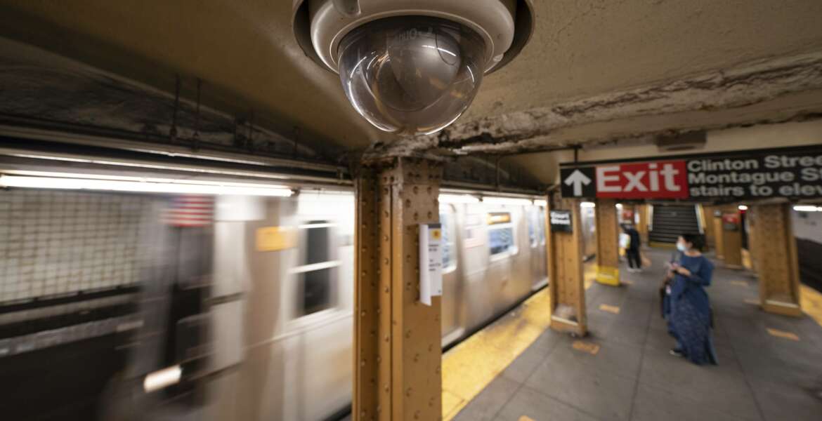 FILE - In this Oct. 7, 2020, file photo, a video surveillance camera is installed on the ceiling above a subway platform in the Court Street station in the Brooklyn borough of New York. State lawmakers across the U.S. are reconsidering the tradeoffs of facial recognition technology amid civil rights and racial bias concerns. (AP Photo/Mark Lennihan, File)