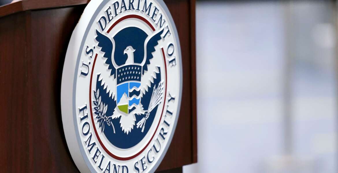 FILE - In this Nov. 20, 2020, file photo a U.S. Department of Homeland Security plaque is displayed a podium as international passengers arrive at Miami international Airport where they are screened by U.S. Customs and Border Protection in Miami. The Department of Homeland Security plans to ramp up its social media tracking as part of an enhanced focus on domestic violent extremism. The move is a response ding to weaknesses exposed by the deadly Capitol insurrection but also raising longstanding concerns about protecting Americans’ civil liberties. (AP Photo/Lynne Sladky, File)