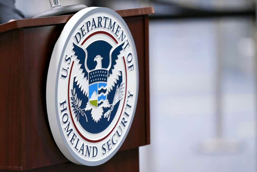 FILE - In this Nov. 20, 2020, file photo a U.S. Department of Homeland Security plaque is displayed a podium as international passengers arrive at Miami international Airport where they are screened by U.S. Customs and Border Protection in Miami. The Department of Homeland Security plans to ramp up its social media tracking as part of an enhanced focus on domestic violent extremism. The move is a response ding to weaknesses exposed by the deadly Capitol insurrection but also raising longstanding concerns about protecting Americans’ civil liberties. (AP Photo/Lynne Sladky, File)