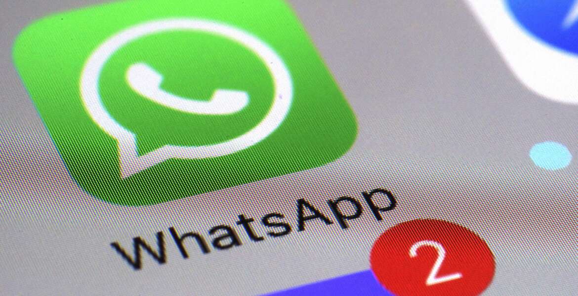 FILE - This March 10, 2017 file photo shows the WhatsApp communications app on a smartphone, in New York. The messaging app WhatsApp has sued the Indian government seeking to defend its users' privacy and stop new rules that would require it to make messages “traceable” to external parties. WhatsApp filed the lawsuit Wednesday, May 26, 2021 in the Delhi High Court, and is arguing that the government rules regarding the traceability of messages are unconstitutional and undermine the fundamental right to privacy. (AP Photo/Patrick Sison, File)