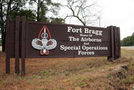 FILE - This Jan. 4, 2020 file photo shows a sign for at Fort Bragg, N.C. The push to remove Confederate names from Pentagon properties, including storied Army posts, could eventually affect hundreds of items and facilities, the chair of the congressionally chartered Naming Commission said Friday, May 21, 2021. The initial public focus was on Army bases such as Fort Bragg, North Carolina, which is named for Confederate general Braxton Bragg, and Fort Benning, Georgia, named for Brig. Gen. Henry L. Benning, who served under Lee. (AP Photo/Chris Seward, File)