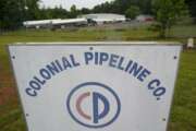 Tanker trucks are parked near the entrance of Colonial Pipeline Company Wednesday, May 12, 2021, in Charlotte, N.C.  Several gas stations in the Southeast reported running out of fuel, primarily because of what analysts say is unwarranted panic-buying among drivers, as the shutdown of a major pipeline by hackers entered its fifth day.  (AP Photo/Chris Carlson)