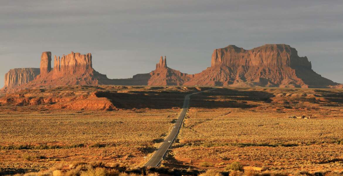 FILE - In this Oct. 25, 2018 file photo, Monument Valley is shown in Utah. The Navajo Nation has by far the largest land mass of any Native American tribe in the country. Now, it's boasting the largest enrolled population, too. The number grew to nearly 400,000 because of payments made to individual Navajos for hardships during the pandemic. The tribe now tops the Cherokee Nation's enrollment of 392,000, but a tribal spokeswoman says the Oklahoma tribe also is growing. (AP Photo/Rick Bowmer, File)