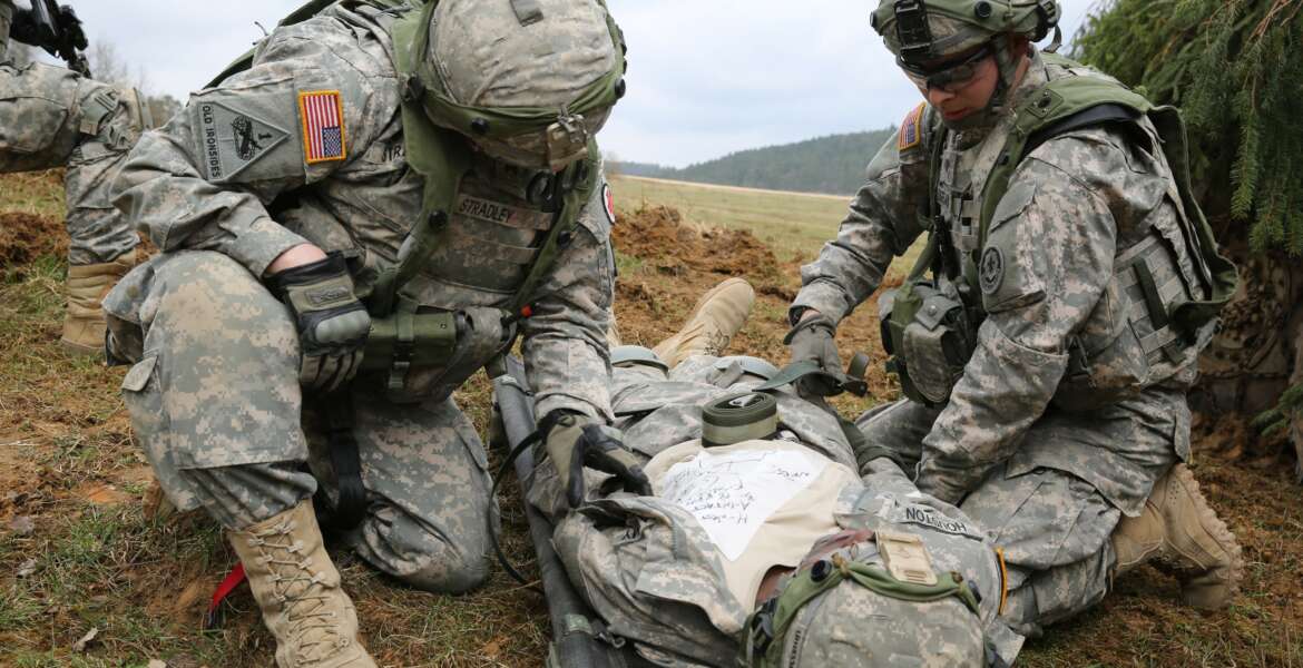 U.S. Soldiers assigned to Bravo Troop, 1st Squadron, 2nd Cavalry Division strap in a simulated wounded Soldier to a litter while conducting a movement to contact drill during exercise Saber Junction 15 at the U.S. Army’s Joint Multinational Readiness Center in Hohenfels, Germany, April 12, 2015. Saber Junction 15 prepares NATO and partner nation forces for offensive, defensive, and stability operations and promotes interoperability among participants. Saber Junction 15 has more than 4,700 participants from 17 countries, to include: Albania, Armenia, Belgium, Bosnia, Bulgaria, Great Britain, Hungary, Latvia, Lithuania, Luxembourg, Macedonia, Moldova, Poland, Romania, Sweden, Turkey, and the U.S. (U.S. Army photo by Spc. Brian Chaney/Released) (Spc. Brian Chaney)

