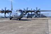 Nineteen C-130J aircraft take part in an elephant walk before takeoff during an exercise Mar. 15, 2018, at Little Rock Air Force Base, Ark. Numerous C-130J units from around the Air Force participated in a training event to enhance operational effectiveness and joint interoperability. (U.S. Air Force photo by Airman 1st Class Rhett Isbell)