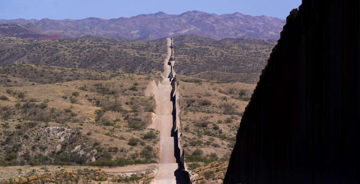 A new border wall stretches along the landscape near Sasabe, Ariz., on Wednesday, May 19, 2021. (AP Photo/Ross D. Franklin)