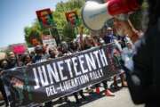 FILE- In this June 19, 2020, file photo, protesters chant as they march after a Juneteenth rally at the Brooklyn Museum, in the Brooklyn borough of New York. (AP Photo/John Minchillo, File)