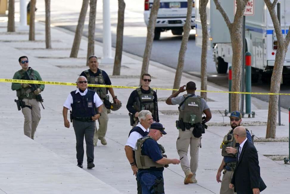 FILE - In this Sept. 15, 2020, file photo, federal law enforcement personnel patrol outside the Sandra Day O'Connor Federal Courthouse in Phoenix. The U.S. Marshals Service lacks the capability of adequately detecting threats against federal judges across the nation and uses outdated security equipment to protect judges’ homes, the Justice Department’s inspector general said Wednesday.  (AP Photo/Ross D. Franklin, File)