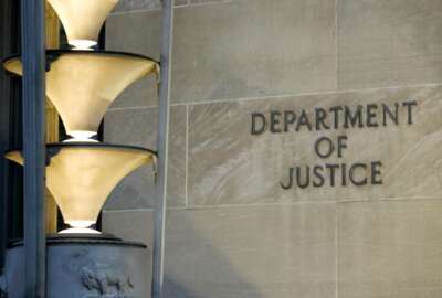 The Department of Justice is seen, Friday, March 22, 2019, in Washington. The Justice Department under former President Donald Trump secretly seized data from the accounts of at least two Democratic lawmakers in 2018 as part of an aggressive crackdown on leaks related to the Russia investigation and other national security matters, according to three people familiar with the seizures.  (AP Photo/Alex Brandon)