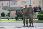 Staff Sgt. Galen Peterson, left, an ammunition NCO with Distribution Management Center, 19th Expeditionary Sustainment Command, poses with his son Spc. Justin Peterson, a Religious Affairs Specialist with 94th Military Police Battalion, in front of 19th ESC headquarters on Camp Henry. After growing up as an Army brat, Spc. Peterson enlisted in the Army in 2018 and now father and son are both stationed in Korea. (Capt. Cortland Henderson)