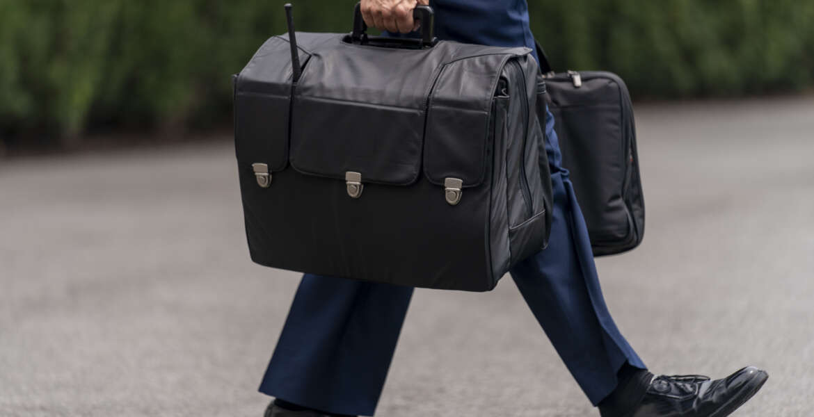 A U.S. military aide carries the 